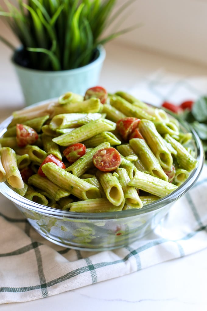 This Spinach Pesto Pasta Salad is the perfect side dish for spring and summer! Can be served hot or cold and is great for make ahead!