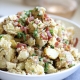 This Creamy Caesar Bacon Potato Salad is the perfect clean and Whole30 side dish recipe for summer! All the best flavors to create a great BBQ staple!