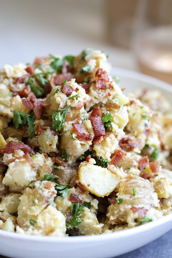 This Creamy Caesar Bacon Potato Salad is the perfect clean and Whole30 side dish recipe for summer! All the best flavors to create a great BBQ staple!