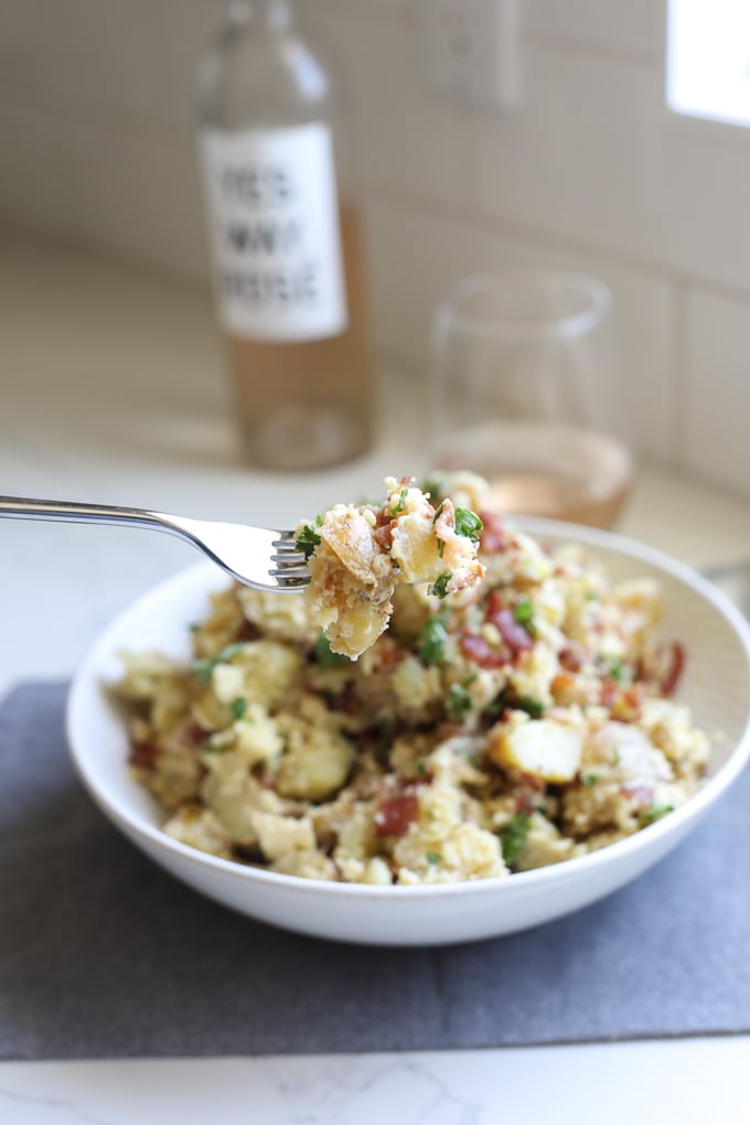 This Creamy Caesar Bacon Potato Salad is the perfect clean and Whole30 side dish recipe for summer! All the best flavors to create a great BBQ staple!