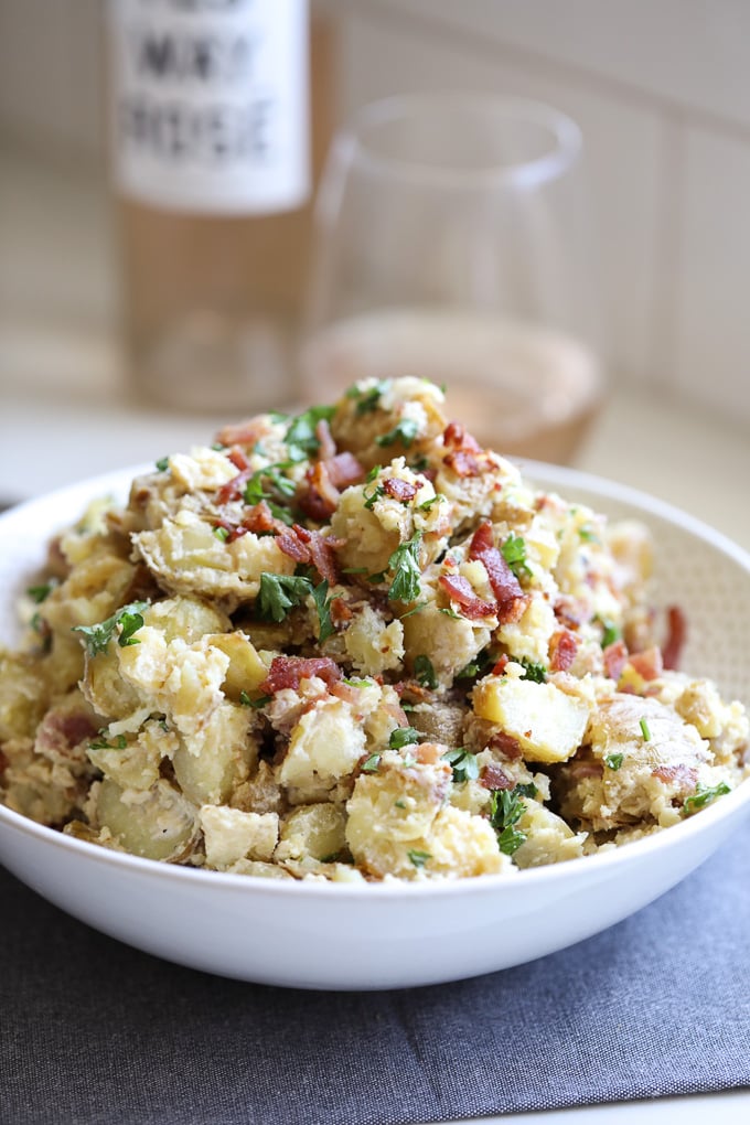 This Creamy Caesar Bacon Potato Salad is the perfect clean and Whole30 side dish recipe for summer! All the best flavors to create a great BBQ staple!