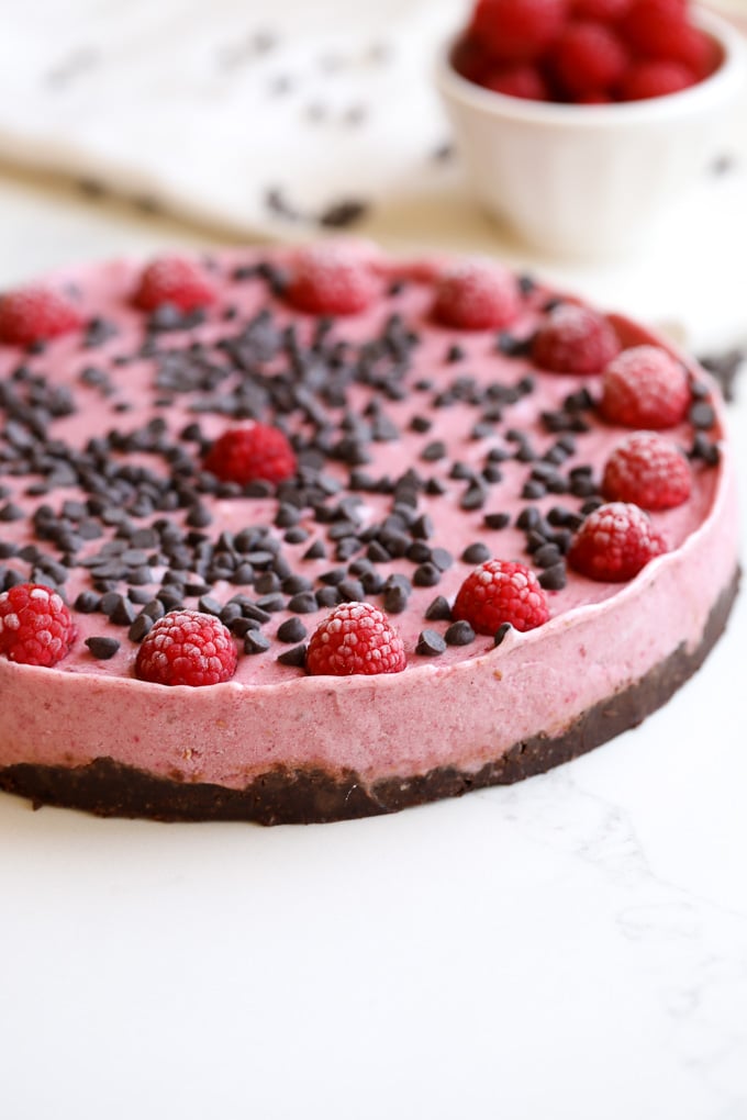 This raspberry chocolate chip nice cream tart is the perfect summer treat that is packed with flavor and made with clean ingredients!