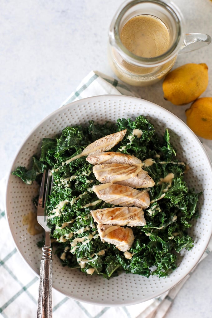 This Warm Kale Chicken Caesar Salad is a great way to enjoy a salad in the colder months! Whole30 compliant and an easy caesar dressing that is dairy free!