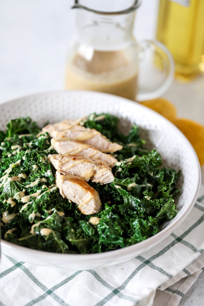 This Warm Kale Chicken Caesar Salad is a great way to enjoy a salad in the colder months! Whole30 compliant and an easy caesar dressing that is dairy free!