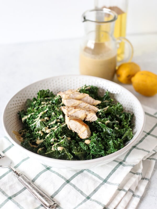 This Warm Kale Chicken Caesar Salad is a great way to enjoy a salad in the colder months! Whole30 compliant and an easy caesar dressing that is dairy free!