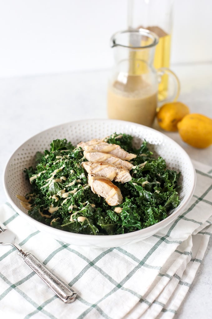 This Warm Kale Chicken Caesar Salad is a great way to enjoy a salad in the colder months! Whole30 compliant and an easy caesar dressing that is dairy free!