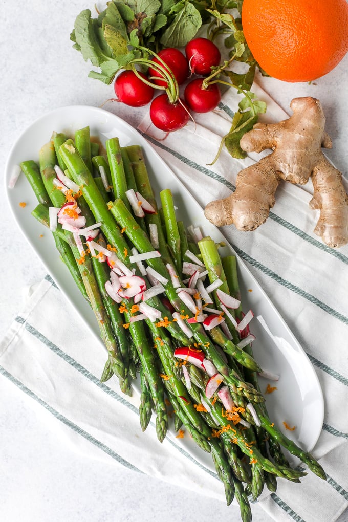 This Orange Ginger Asparagus & Radish Salad is full of spring veggies and delicious flavors. It is also whole30 and super simple!!