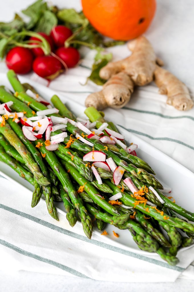 This Orange Ginger Asparagus & Radish Salad is full of spring veggies and delicious flavors. It is also whole30 and super simple!!