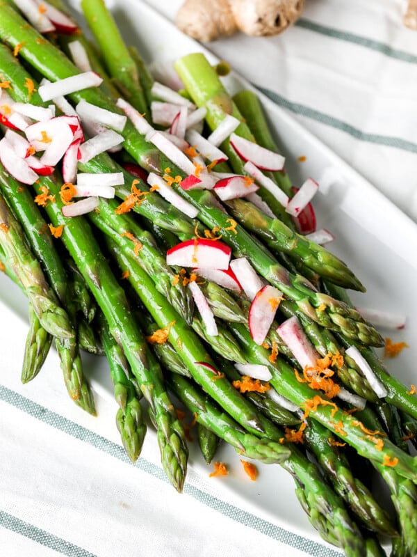 This Orange Ginger Asparagus & Radish Salad is full of spring veggies and delicious flavors. It is also whole30 and super simple!!