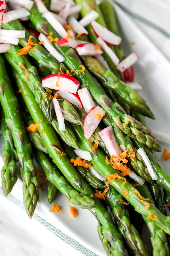 This Orange Ginger Asparagus & Radish Salad is full of spring veggies and delicious flavors. It is also whole30 and super simple!!