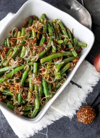 These Green Beans with Sweet Dijon Sauce and Crispy Shallots are a super easy whole30 side dish that everyone will love!