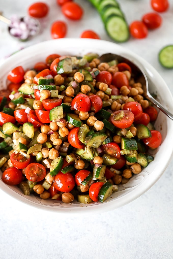 This Mediterranean Veggie & Chickpea Salad is a fresh and nourishing side dish that is great for any potluck or or to prep for the week!