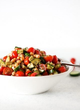 This Mediterranean Veggie & Chickpea Salad is a fresh and nourishing side dish that is great for any potluck or or to prep for the week!