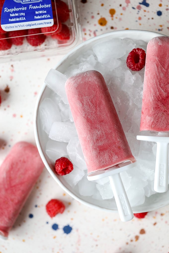 These Raspberries and Cream Popsicles are paleo, super simple to make and only have 4 ingredients!