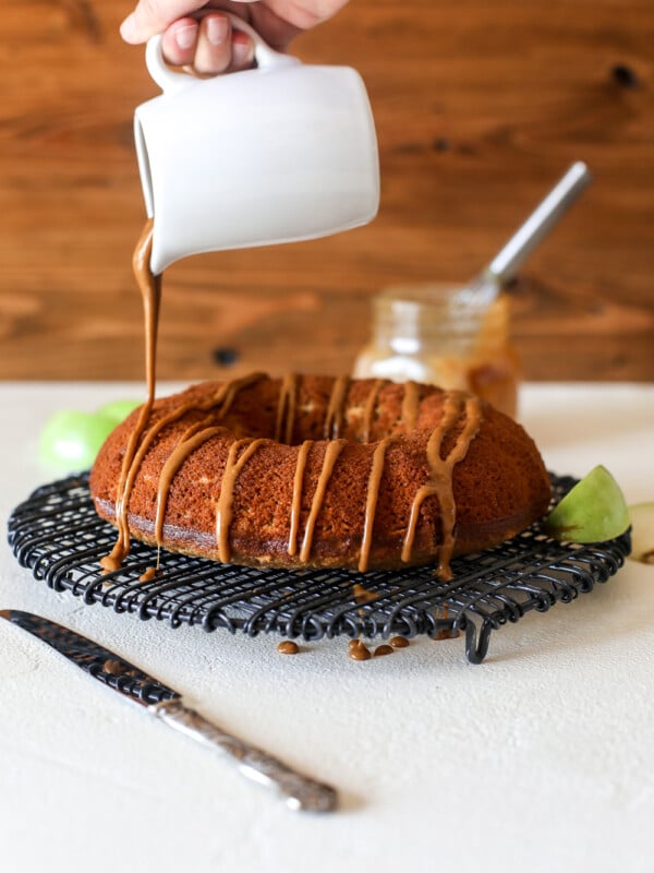 This apple cake with salted caramel glaze is grain free, dairy free and perfect for a healthy fall treat!