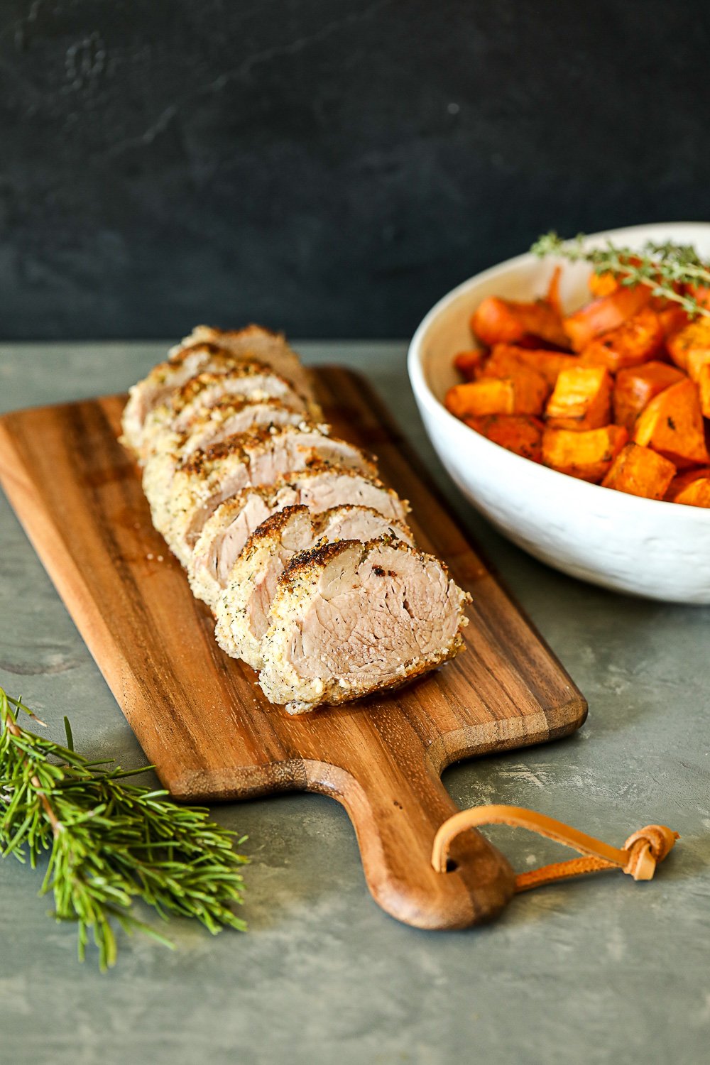 This Garlic Rosemary Crusted Pork Tenderloin is simple enough for a weeknight but flavorful enough for a main event! It is packed with flavor and the whole30 breading keeps it nice and moist!