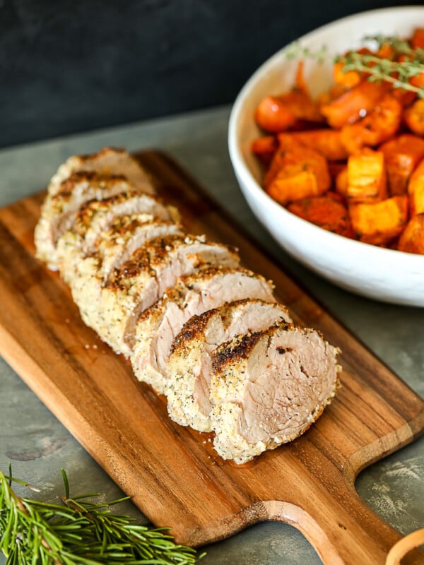 This Garlic Rosemary Crusted Pork Tenderloin is simple enough for a weeknight but flavorful enough for a main event! It is packed with flavor and the whole30 breading keeps it nice and moist!