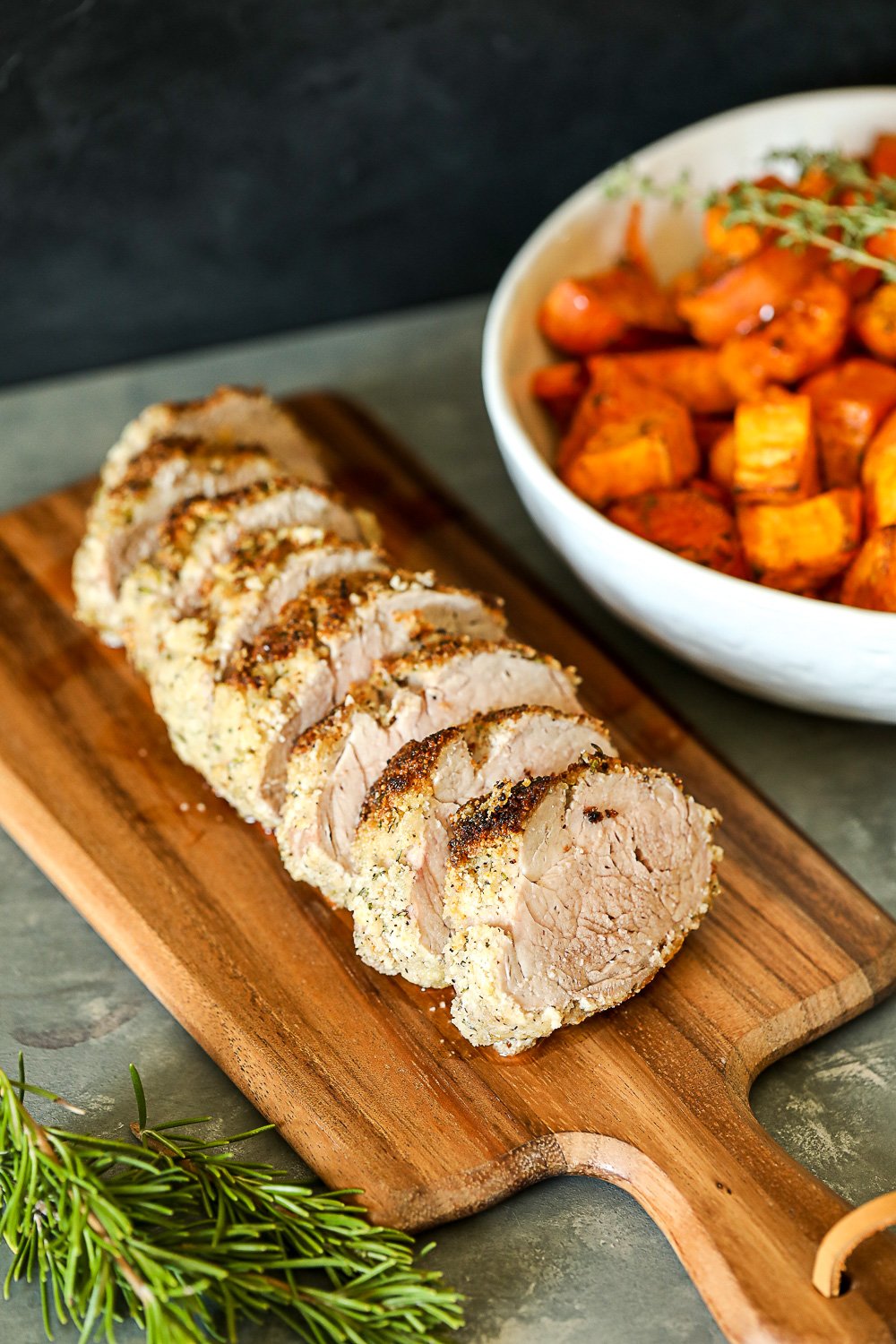 This Garlic Rosemary Crusted Pork Tenderloin is simple enough for a weeknight but flavorful enough for a main event! It is packed with flavor and the whole30 breading keeps it nice and moist!