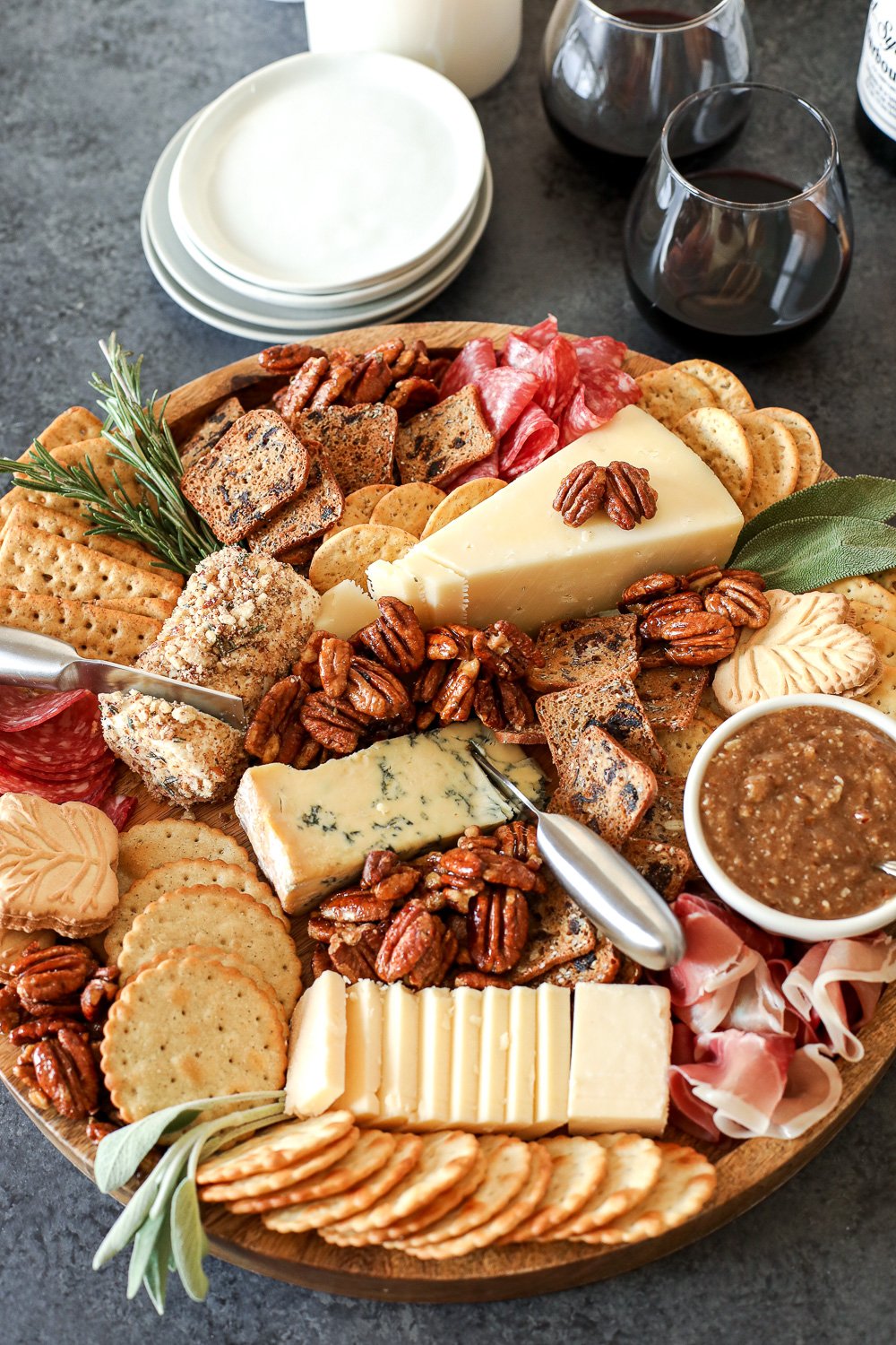 This Pecan-Packed Holiday Charcuterie Board has Maple Sage Pecans, a Rosemary Pecan Crusted Goat Cheese and a Honey Cinnamon Pecan spread that will wow any crowd this holiday!