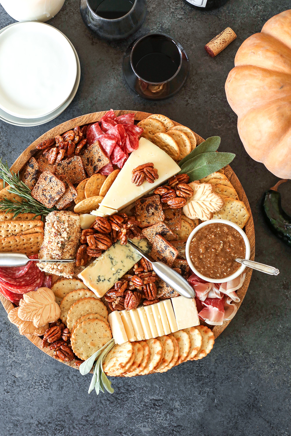 This Pecan-Packed Holiday Charcuterie Board has Maple Sage Pecans, a Rosemary Pecan Crusted Goat Cheese and a Honey Cinnamon Pecan spread that will wow any crowd this holiday!