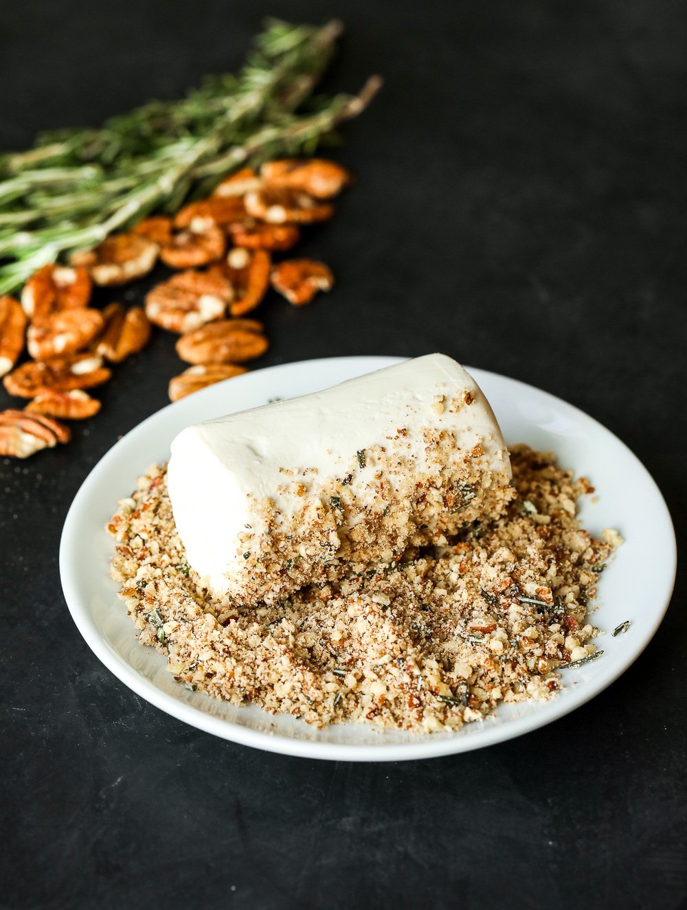 This Pecan-Packed Holiday Charcuterie Board has Maple Sage Pecans, a Rosemary Pecan Crusted Goat Cheese and a Honey Cinnamon Pecan spread that will wow any crowd this holiday!