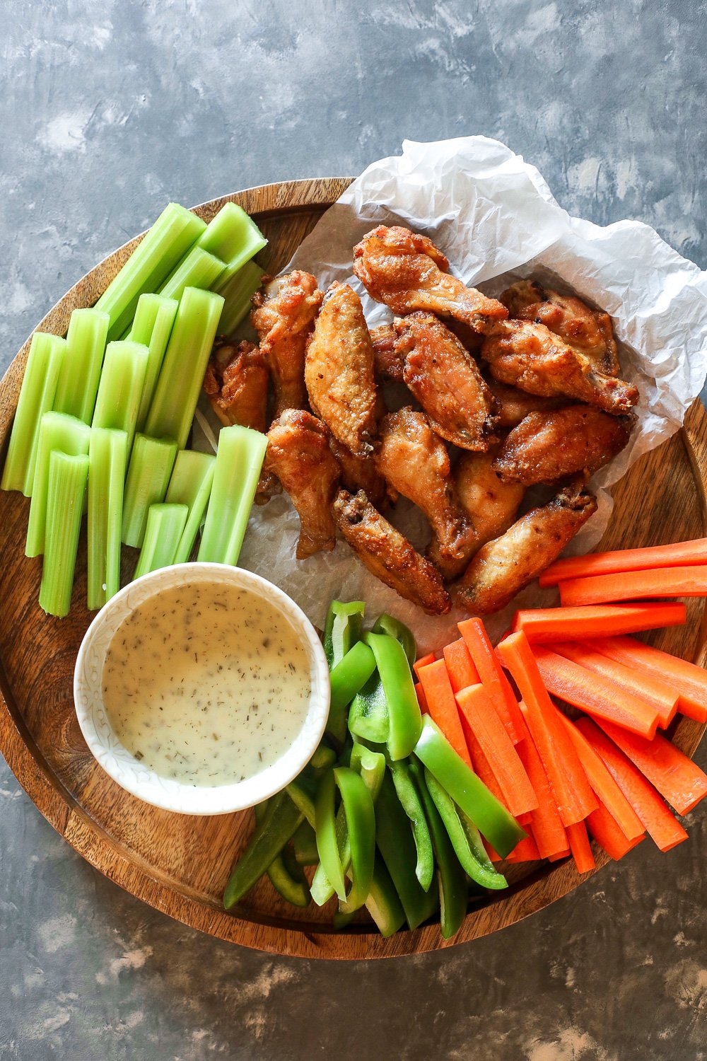 These Crispy Baked Lemon Garlic Chicken Wings are perfect for the super bowl or even just a weeknight!