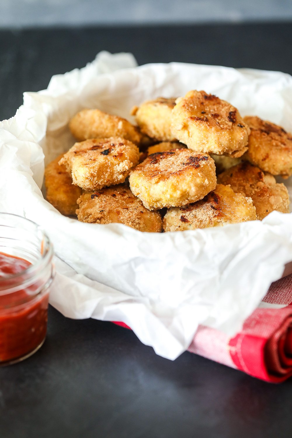 These Veggie Packed Chicken Nuggets are a great way to get sweet potato and broccoli into your kids favorite meal and are also paleo!