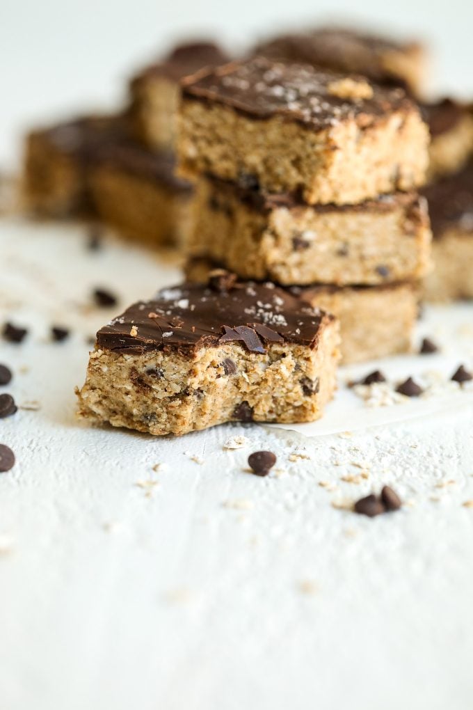 These Oatmeal Chocolate Chip Cookie Dough Bars are gluten free, dairy free, refined sugar free and no bake! They are so simple and so tasty.