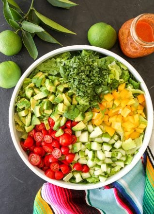 This Fiesta Salad with Salsa Vinaigrette is the perfect side salad with tacos and super easy to make!