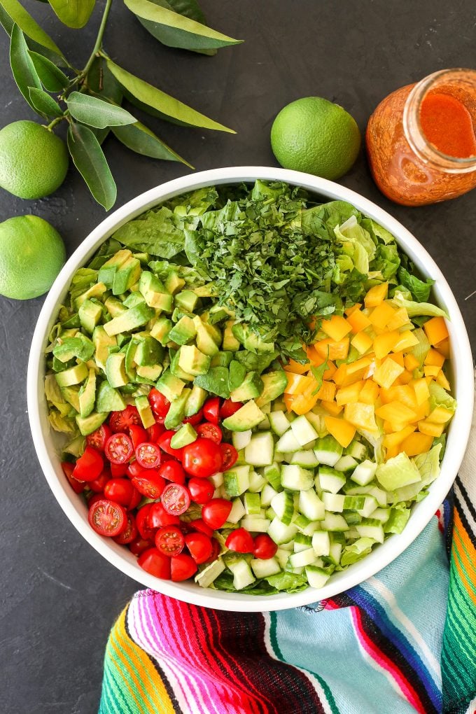 This Fiesta Salad with Salsa Vinaigrette is the perfect side salad with tacos and super easy to make!
