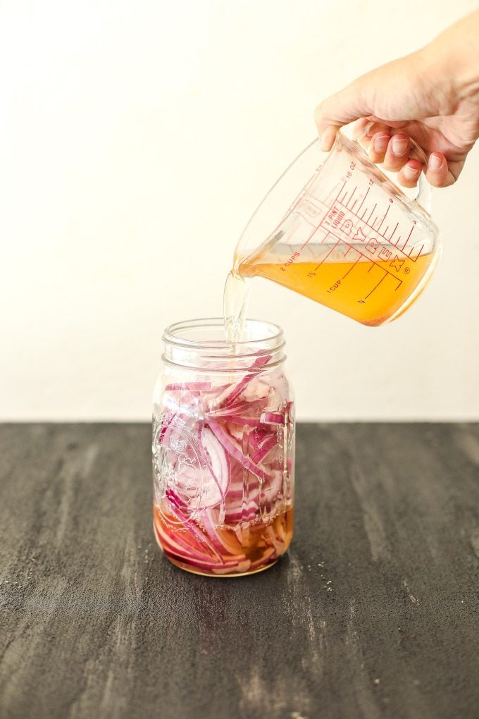These Paleo Pickled Red Onions are a great topping to salads or any meal and made without refined sugar!