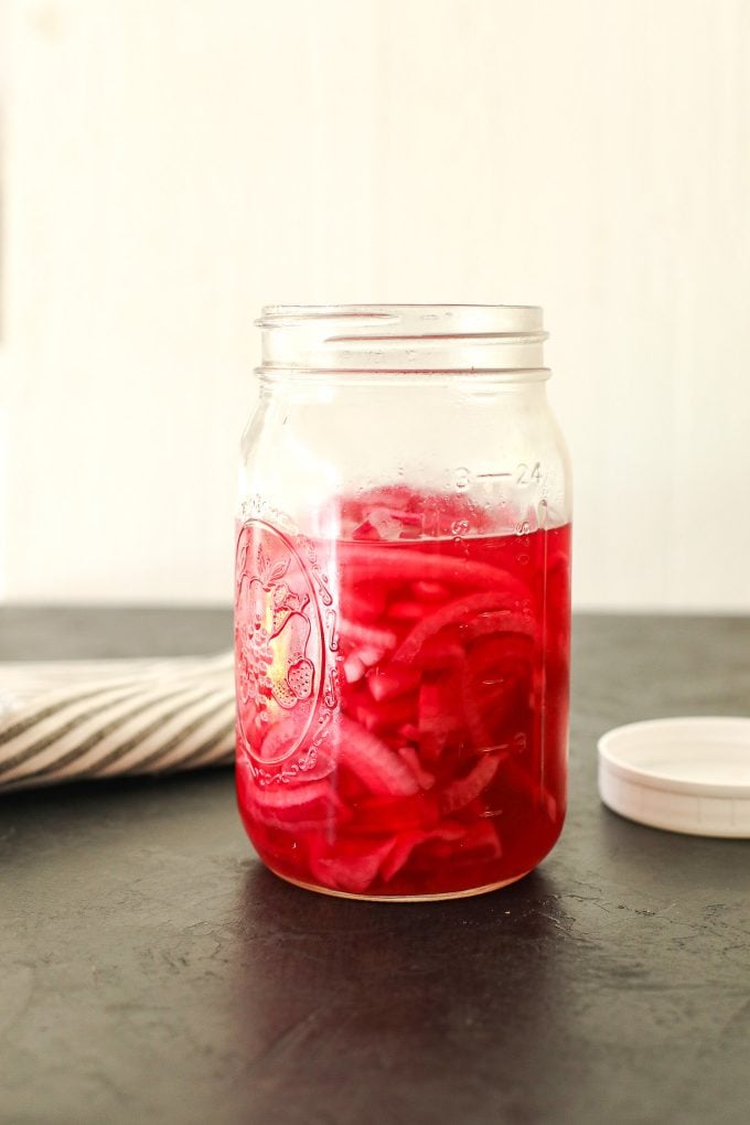 These Paleo Pickled Red Onions are a great topping to salads or any meal and made without refined sugar!