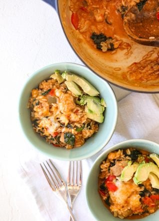 This One-Pot Chicken Enchilada Rice is gluten free and super easy to make on a weeknight. It also has hidden veggies for kiddos!