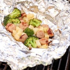 These Chicken Sausage, Potato & Broccoli Foil Packets are perfect for a quick dinner on the grill or while camping!