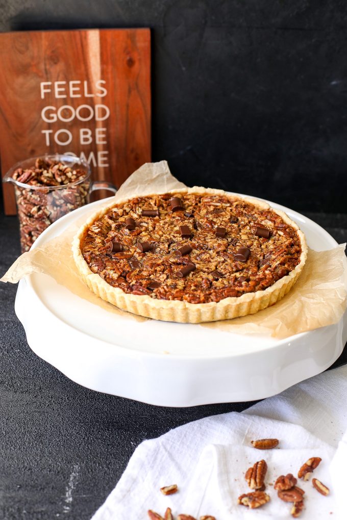 This Chocolate Chunk Bourbon Pecan Tart is a simple and delicious recipe that is gluten free and refined sugar free - no corn syrup!