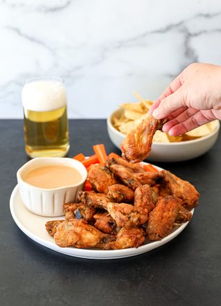 This Baked Thai Chicken Wings with peanut dipping sauce recipe is so delicious and perfect for any weeknight or big game!