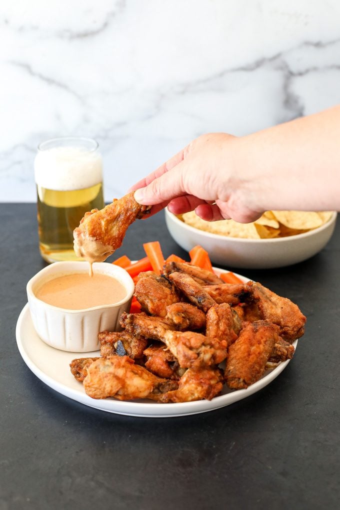 This Baked Thai Chicken Wings with peanut dipping sauce recipe is so delicious and perfect for any weeknight or big game!