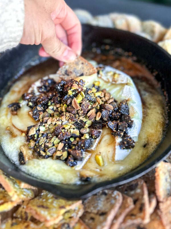 Indulge in creamy brie layered with port-soaked figs & crunchy pistachios—a gourmet, sweet-savory delight perfect for cheese lovers.