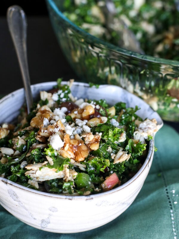 Crisp chopped kale Waldorf salad with apples, walnuts, and a tangy dressing. A healthy twist on the classic recipe!