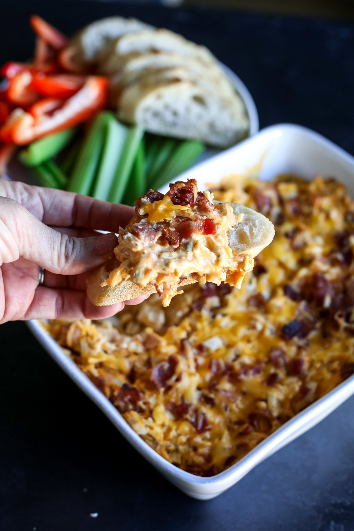 This High Protein Buffalo Chicken Bacon Ranch Dip is the perfect game day snack! Packed with flavor and protein, it's low-carb and keto-friendly.