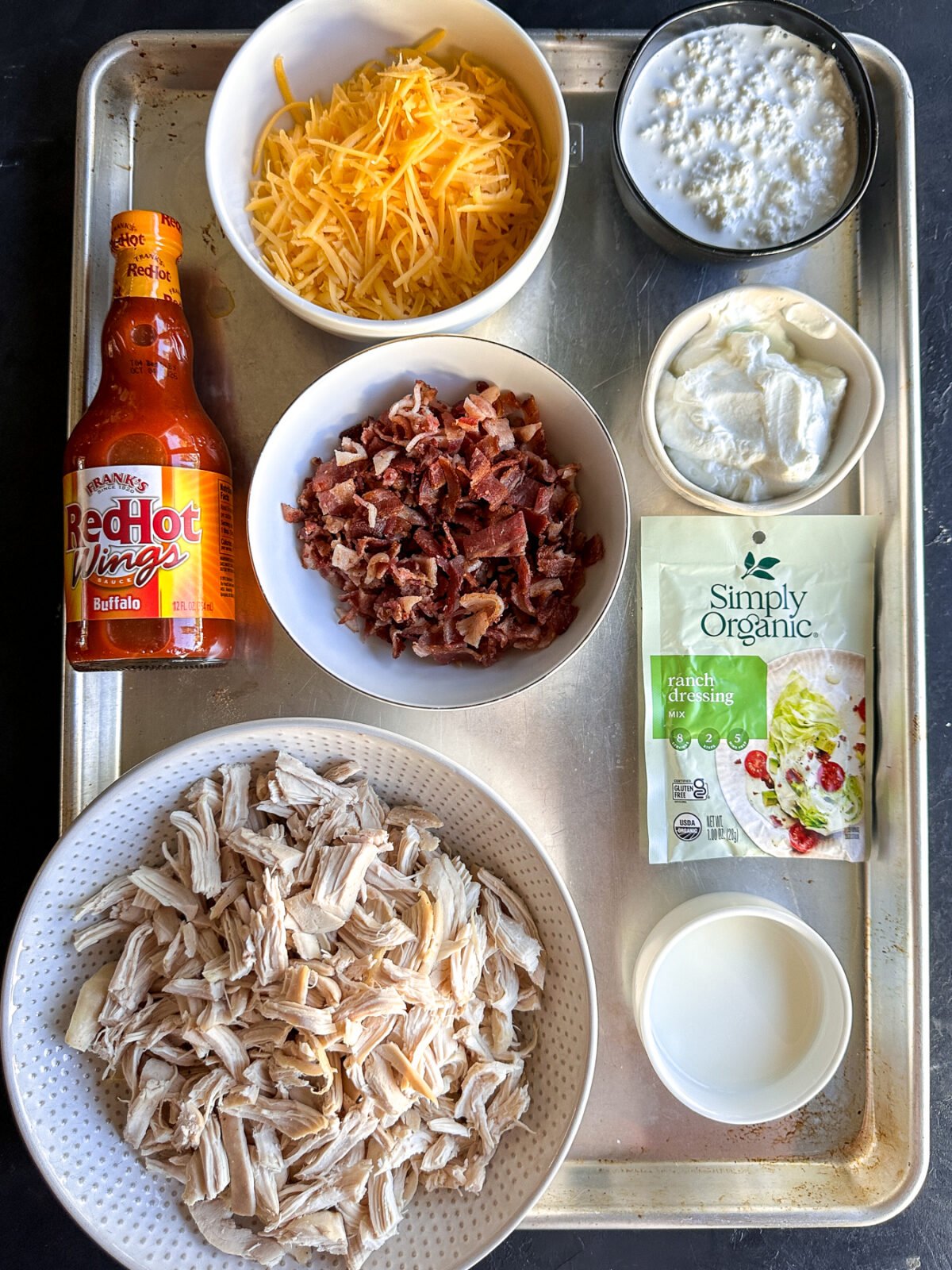 This High Protein Buffalo Chicken Bacon Ranch Dip is the perfect game day snack! Packed with flavor and protein, it's low-carb and keto-friendly.