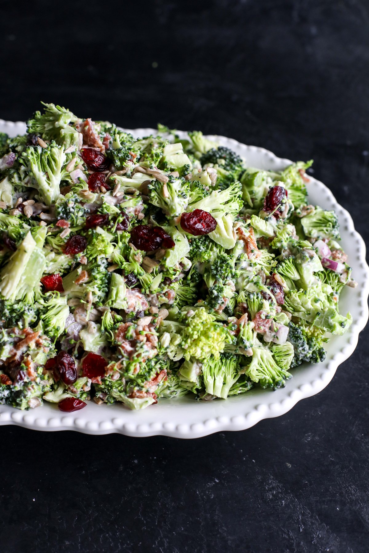 Crunchy & healthy broccoli salad with bacon, cranberries, and a creamy Greek yogurt dressing. Perfect for picnics or a quick side!