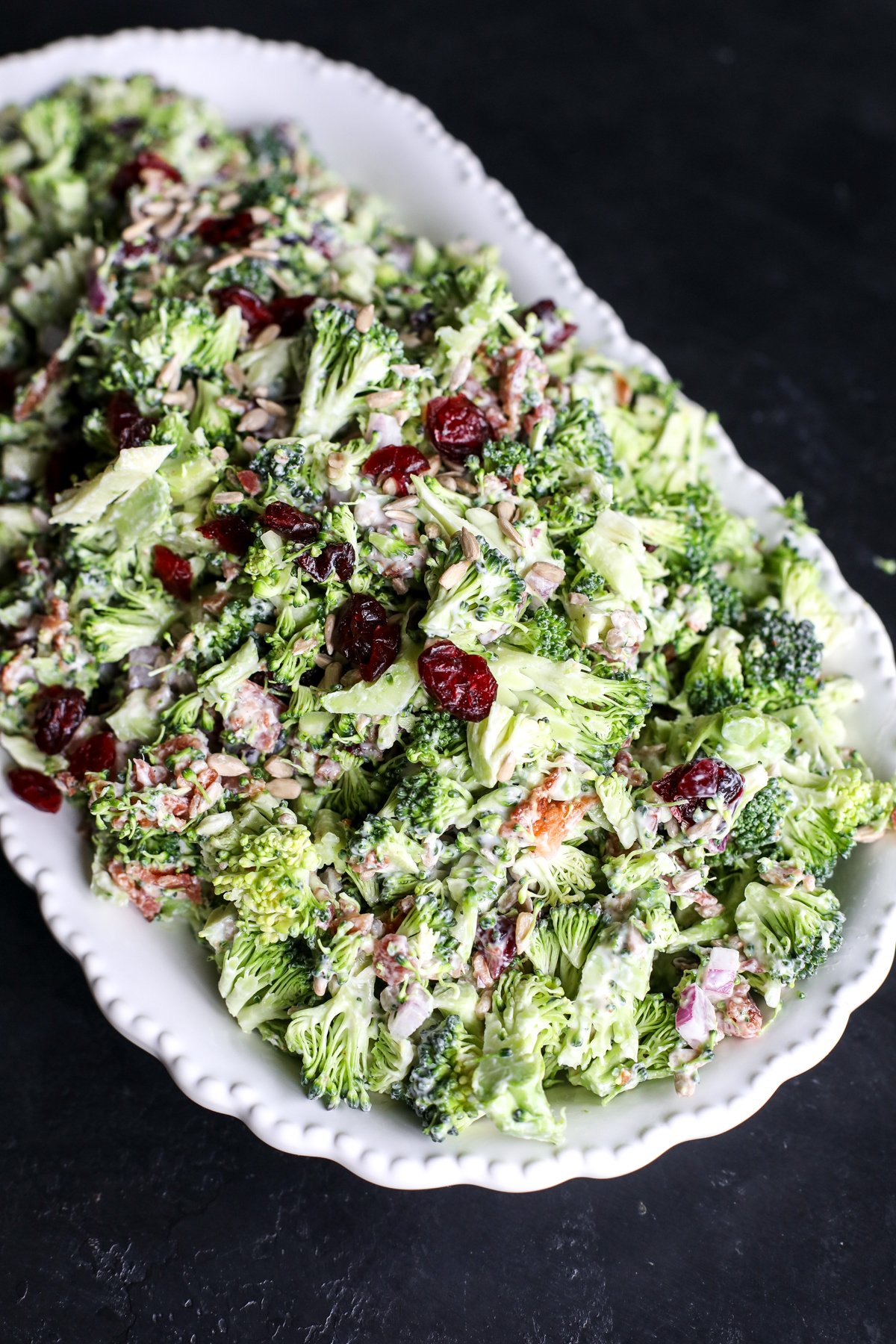 Crunchy & healthy broccoli salad with bacon, cranberries, and a creamy Greek yogurt dressing. Perfect for picnics or a quick side!