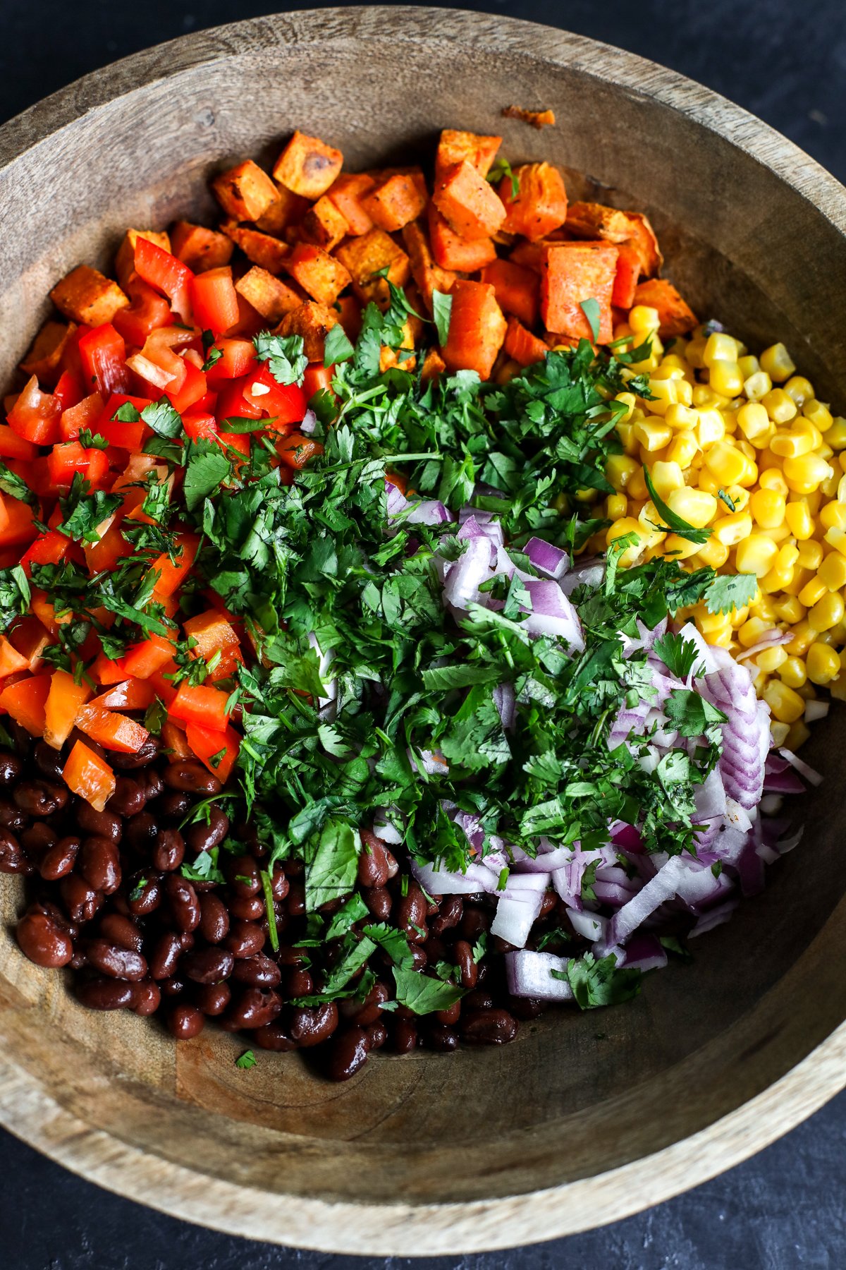 Flavorful Sweet Potato, Black Bean & Corn Salad with a creamy cilantro dressing. Easy, healthy & perfect for a side or light meal!
