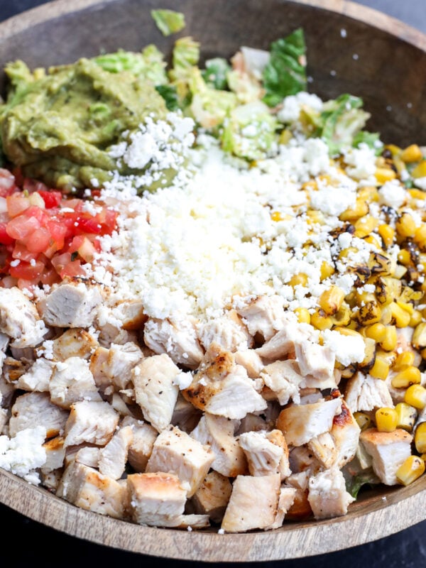 This recipe takes the classic Cobb salad and gives it a delicious Mexican twist! It's super easy to assemble, especially if you use pre-cooked ingredients.