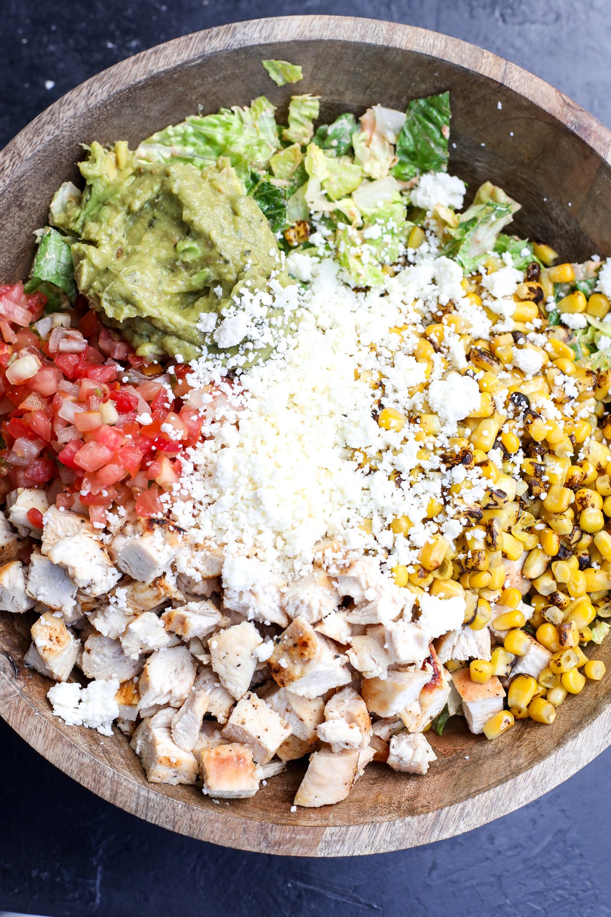 This recipe takes the classic Cobb salad and gives it a delicious Mexican twist! It's super easy to assemble, especially if you use pre-cooked ingredients.