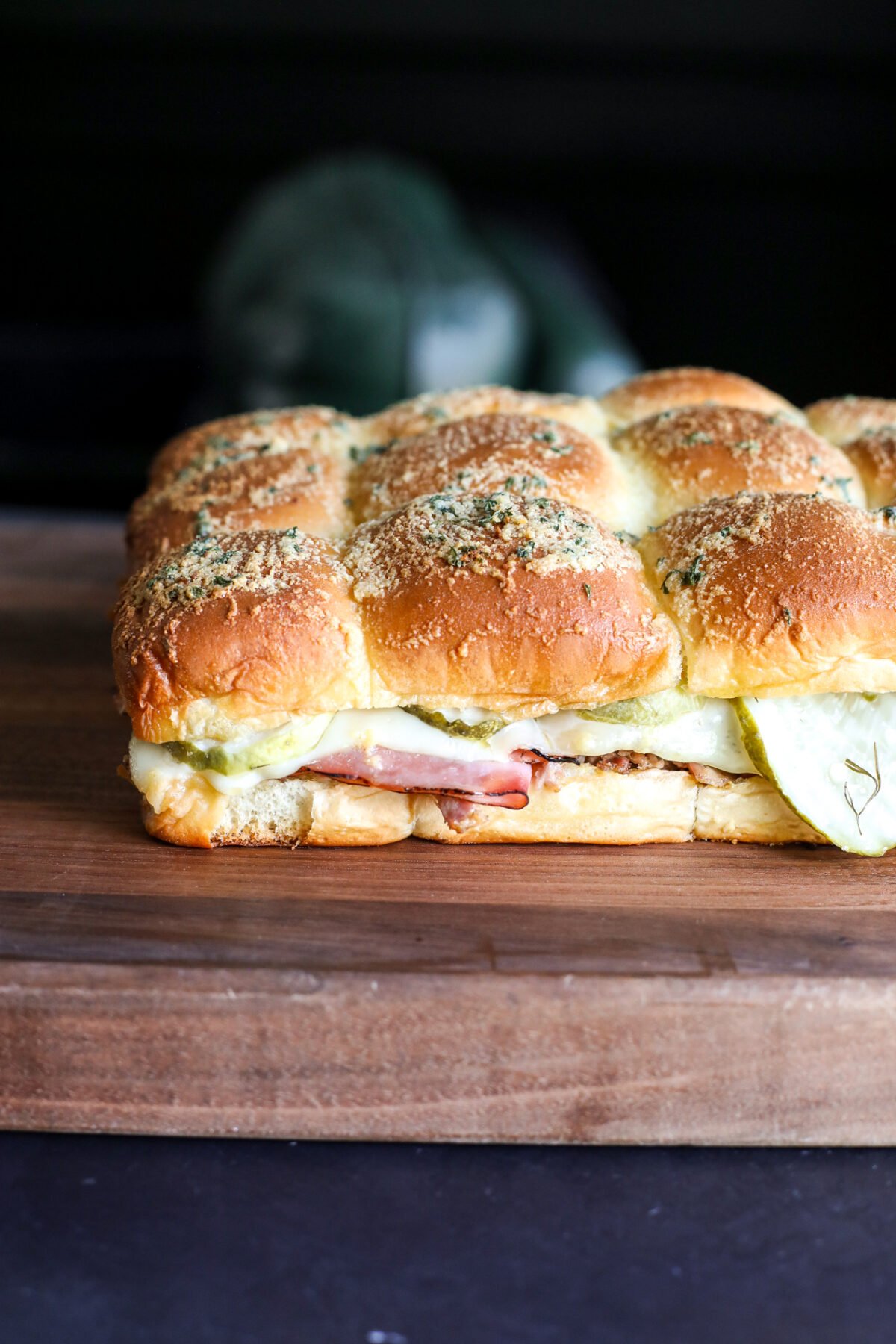 Melted Swiss cheese, savory ham, & slow-cooked pulled pork on sweet Hawaiian rolls. These Cuban sliders are a crowd-pleasing party hit!