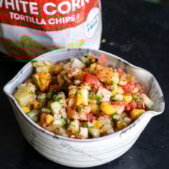 Dive into this vibrant street cart fruit salsa! Made with sweet mango, watermelon, and pineapple, plus a zesty kick from lime, Tajín, and jalapeño. The perfect summer snack or taco topping!