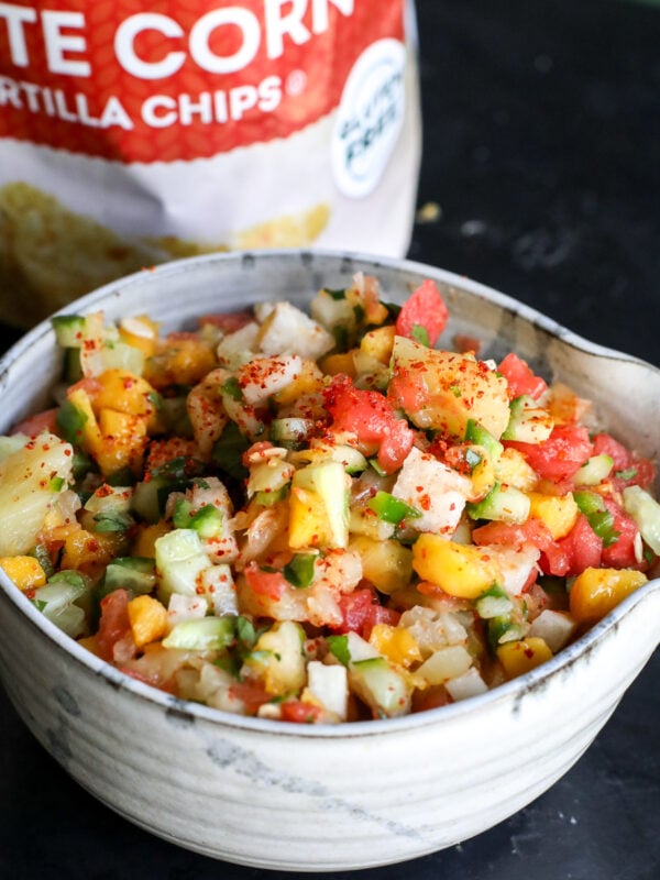 Dive into this vibrant street cart fruit salsa! Made with sweet mango, watermelon, and pineapple, plus a zesty kick from lime, Tajín, and jalapeño. The perfect summer snack or taco topping!