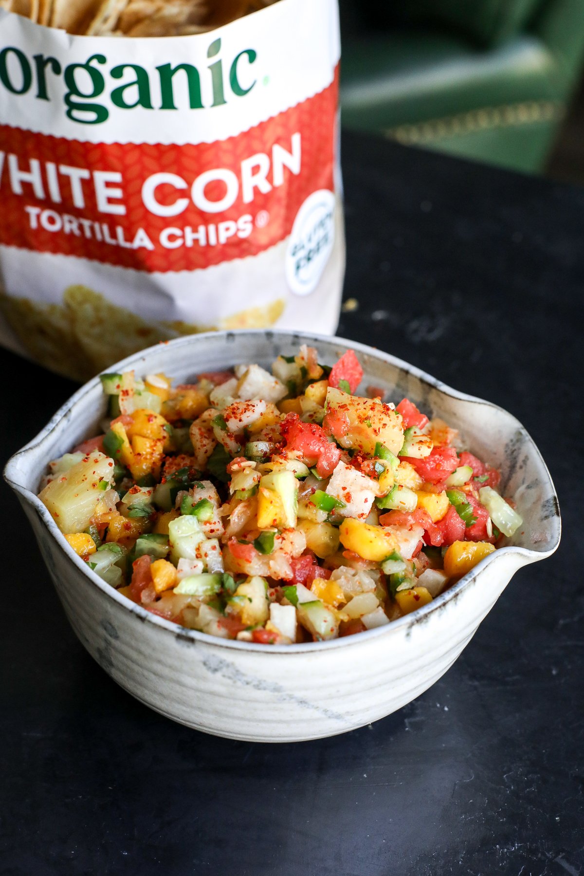 Dive into this vibrant street cart fruit salsa! Made with sweet mango, watermelon, and pineapple, plus a zesty kick from lime, Tajín, and jalapeño. The perfect summer snack or taco topping!
